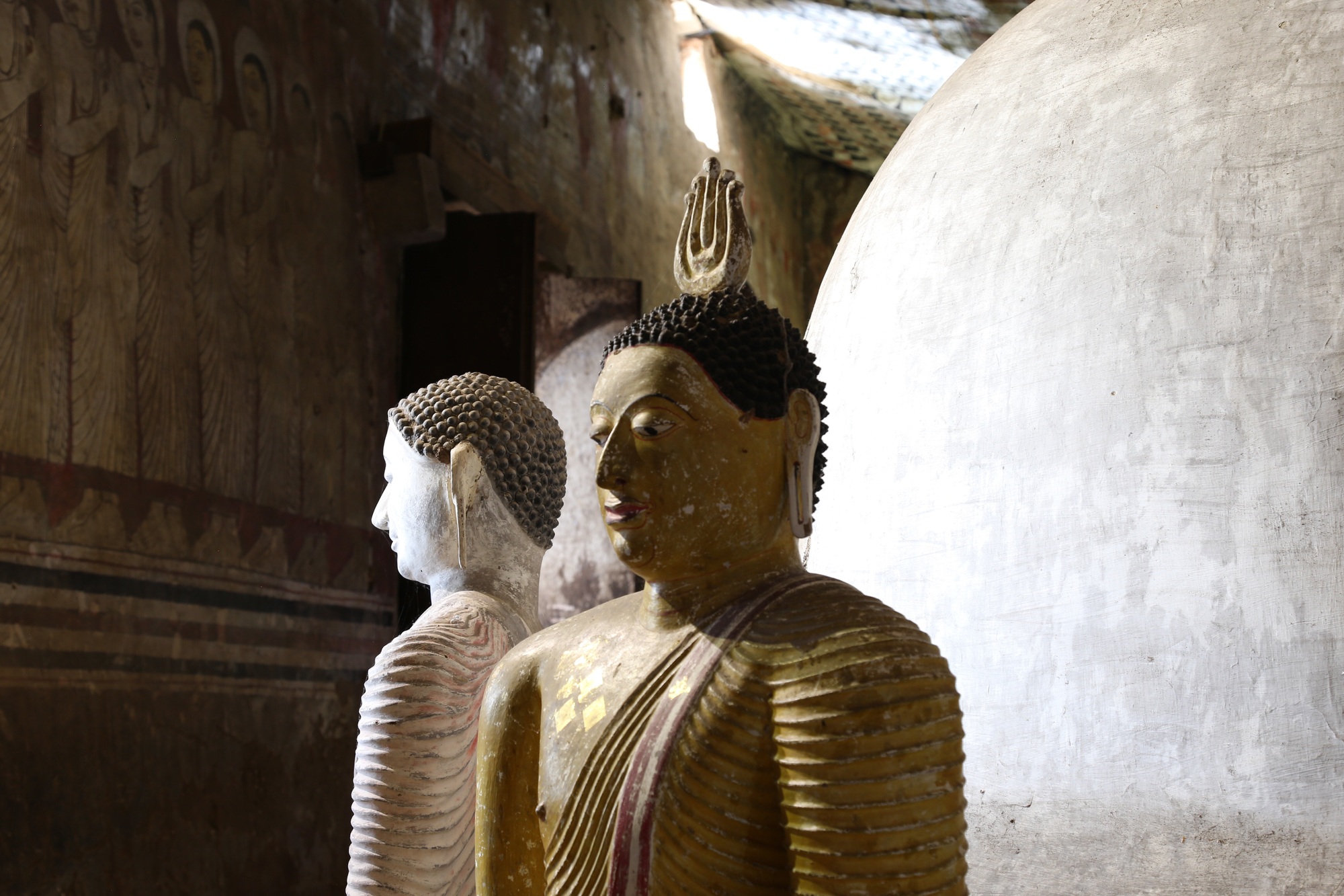 Statues and decorations inside the rock temple in Sri Lanka.